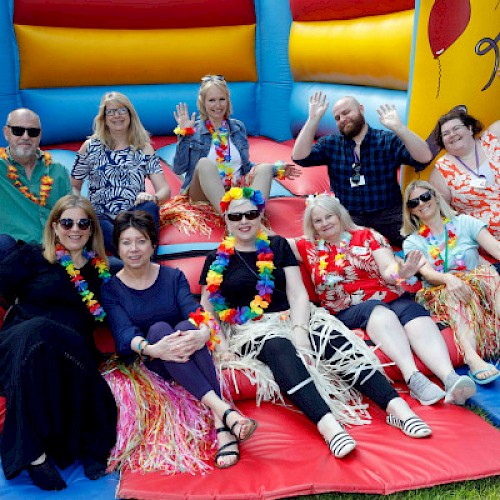 Group of adults on a bouncy castle